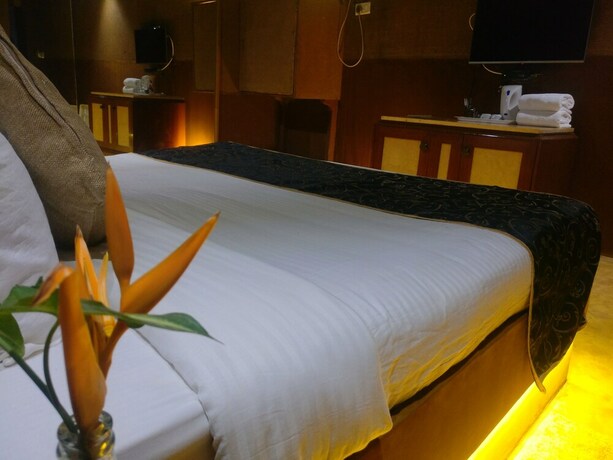 Imagen de la habitación del Hotel The Camelot Beach Resort. Foto 23