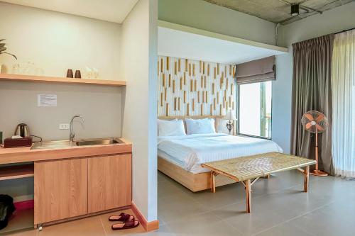 Imagen de la habitación del Hotel The Camp Chiangkhan. Foto 20