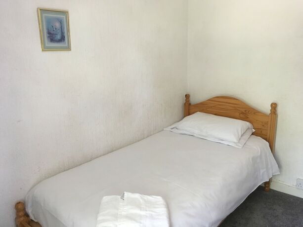 Imagen de la habitación del Hotel The Canberra Guest House. Foto 17