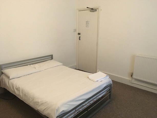 Imagen de la habitación del Hotel The Canberra Guest House. Foto 18