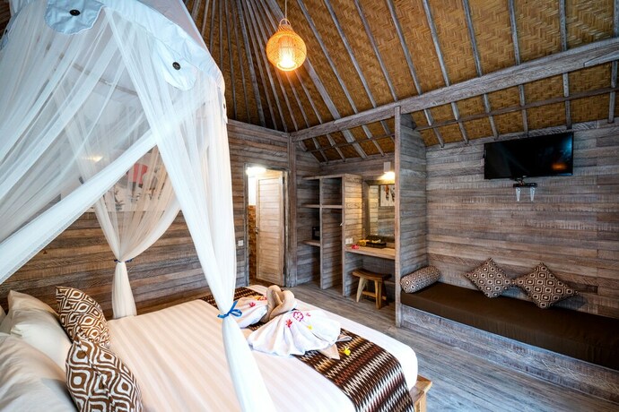 Imagen de la habitación del Hotel The Canda Villas. Foto 32