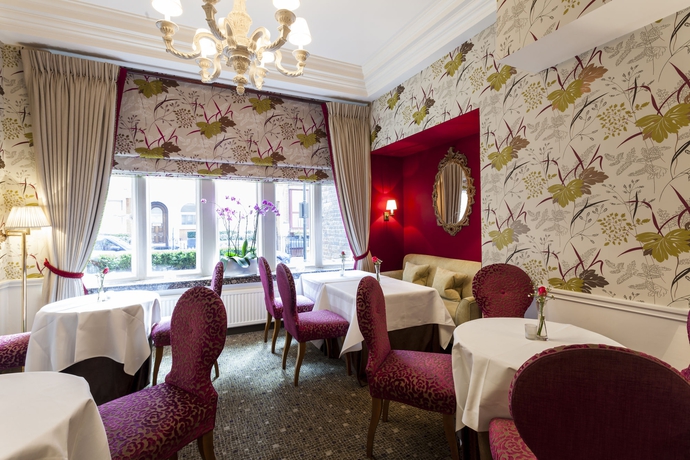 Imagen del bar/restaurante del Hotel The Capital , Apartments and Townhouse. Foto 5