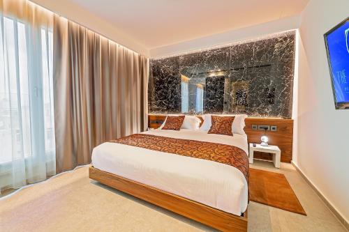 Imagen de la habitación del Hotel The Capital Boutique. Foto 11