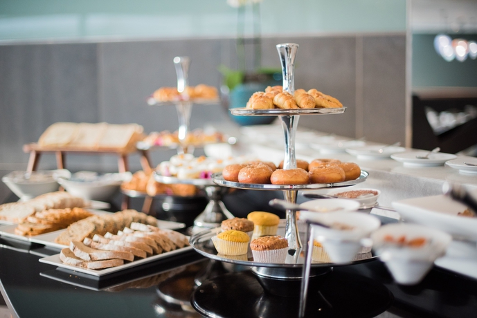 Imagen del bar/restaurante del Hotel The Capital Pearls. Foto 3