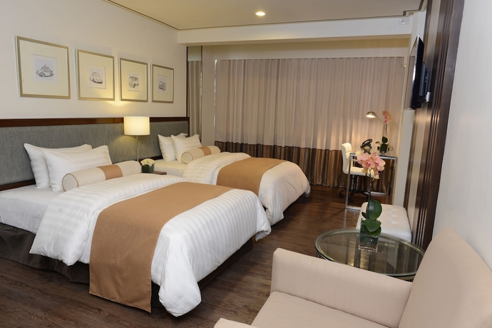 Imagen de la habitación del Hotel The Carmen Hotel. Foto 5