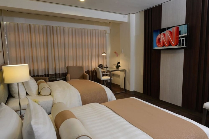 Imagen de la habitación del Hotel The Carmen Hotel. Foto 10