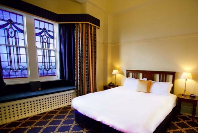 Imagen de la habitación del Hotel The Carrington. Foto 11