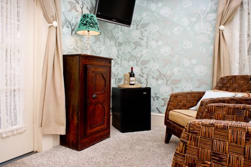 Imagen de la habitación del Hotel The Carroll Villa. Foto 14