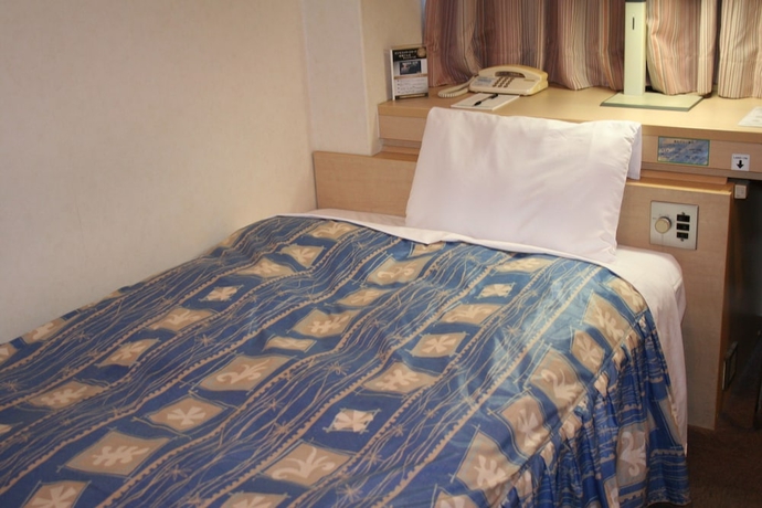 Imagen de la habitación del Hotel The Celecton Takamatsu. Foto 8