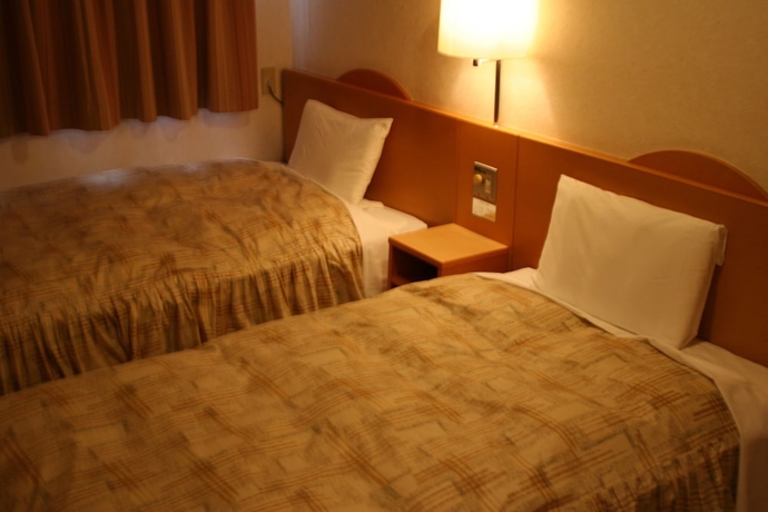 Imagen de la habitación del Hotel The Celecton Takamatsu. Foto 11