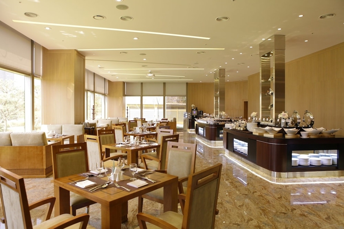 Imagen de la habitación del Hotel The Central Park Songdo. Foto 13