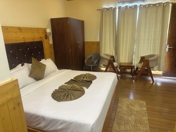 Imagen de la habitación del Hotel The Chail Pine Orchard Resort. Foto 6