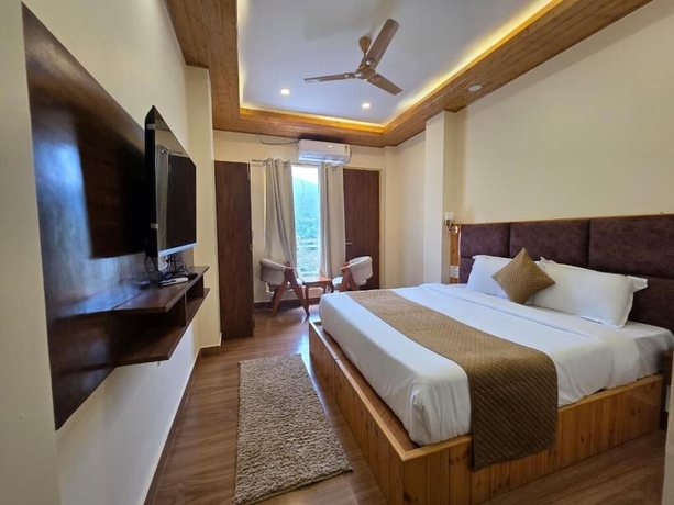 Imagen de la habitación del Hotel The Chail Pine Orchard Resort. Foto 8