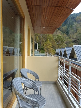 Imagen de la habitación del Hotel The Chail Pine Orchard Resort. Foto 14