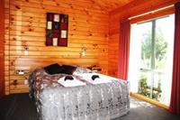 Imagen de la habitación del Hotel The Chalets Motel. Foto 6