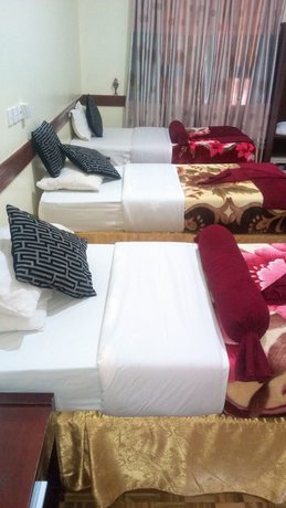 Imagen de la habitación del Hotel The Charity International. Foto 6