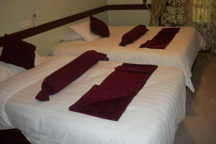 Imagen de la habitación del Hotel The Charity International. Foto 13