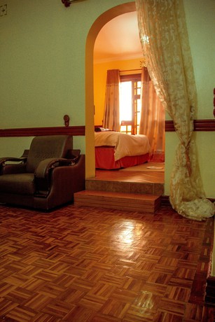 Imagen de la habitación del Hotel The Charity International. Foto 15