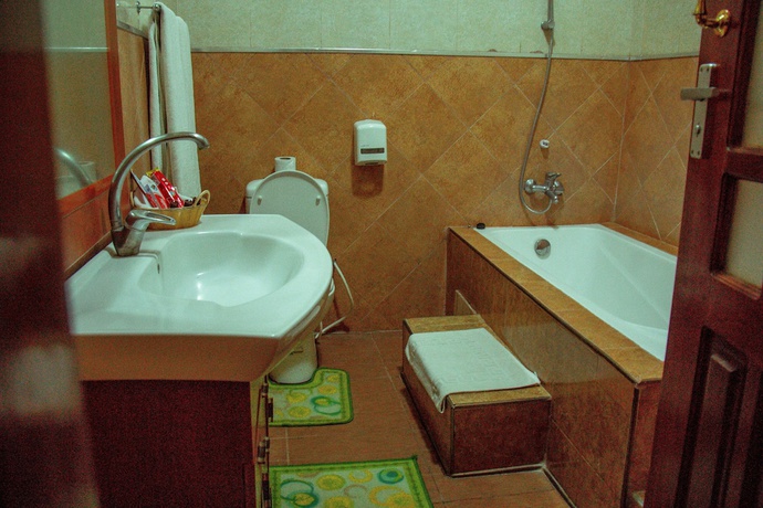 Imagen de la habitación del Hotel The Charity International. Foto 17