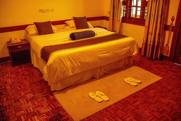 Imagen de la habitación del Hotel The Charity International. Foto 19