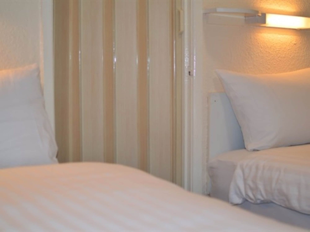 Imagen de la habitación del Hotel The Chimes On The Sea. Foto 8