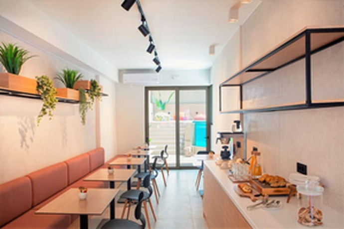 Imagen del bar/restaurante del Hotel The City and Suites. Foto 3