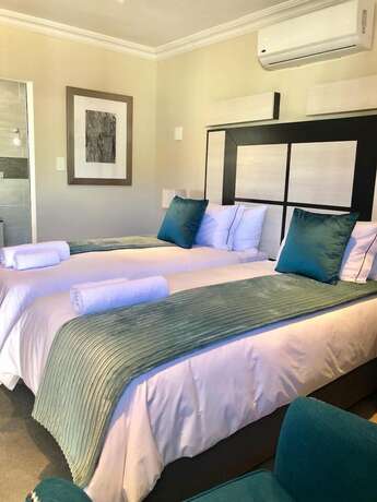 Imagen de la habitación del Hotel The Clan Guest House. Foto 12