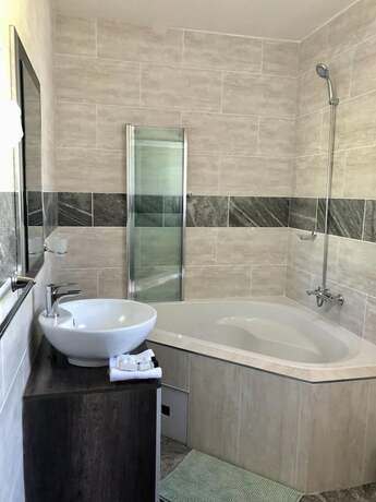 Imagen de la habitación del Hotel The Clan Guest House. Foto 13