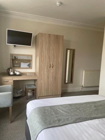 Imagen de la habitación del Hotel The Clarendon. Foto 13