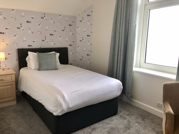 Imagen de la habitación del Hotel The Clarendon. Foto 16