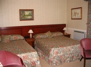 Imagen de la habitación del Hotel The Clubhouse. Foto 2