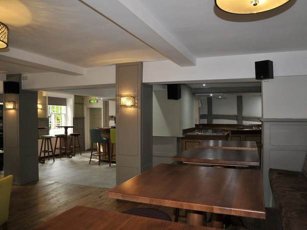 Imagen del bar/restaurante del Hotel The Coach. Foto 10
