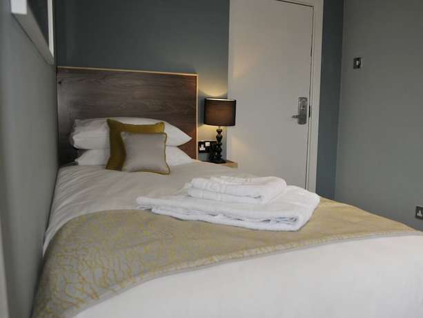 Imagen de la habitación del Hotel The Coach. Foto 13