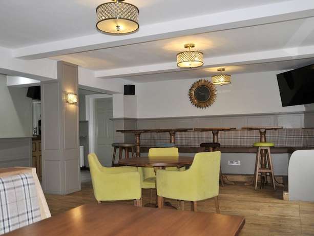 Imagen del bar/restaurante del Hotel The Coach. Foto 11