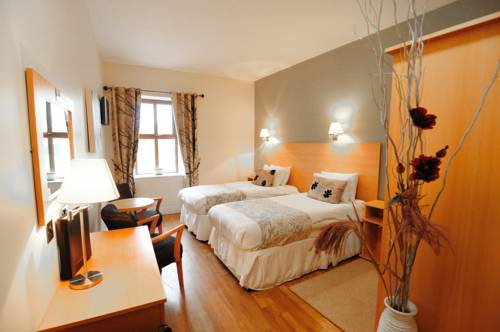 Imagen de la habitación del Hotel The Coach House, Oranmore. Foto 5