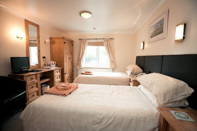 Imagen de la habitación del Hotel The Coach House, Pembroke. Foto 12