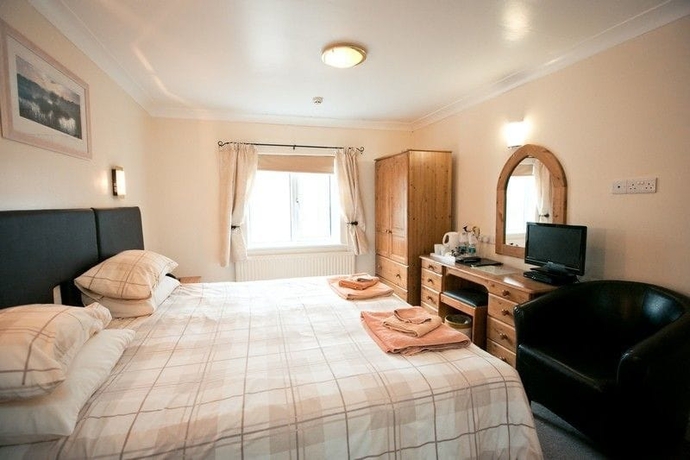 Imagen de la habitación del Hotel The Coach House, Pembroke. Foto 15