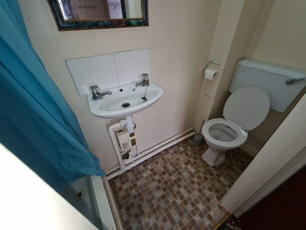 Imagen de la habitación del Hotel The Coach House Rooms. Foto 13