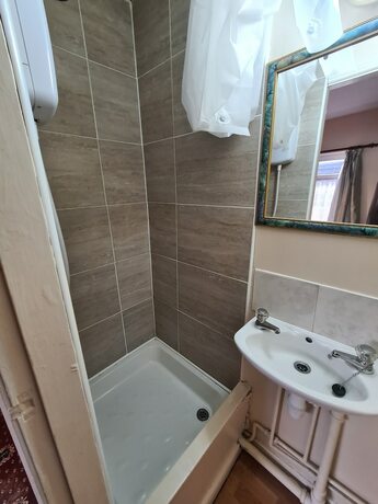 Imagen de la habitación del Hotel The Coach House Rooms. Foto 17