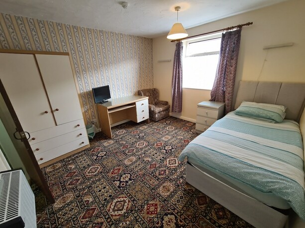Imagen de la habitación del Hotel The Coach House Rooms. Foto 18