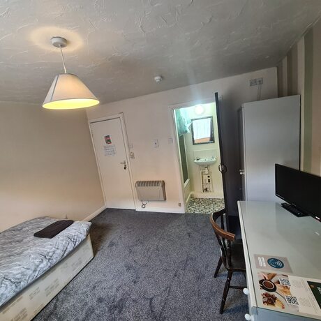 Imagen general del Hotel The Coach House Rooms. Foto 10