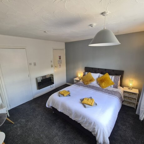 Imagen de la habitación del Hotel The Coach House Rooms. Foto 19
