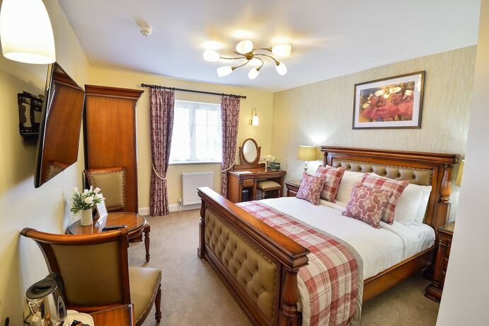 Imagen de la habitación del Hotel The Coach and Horses. Foto 16