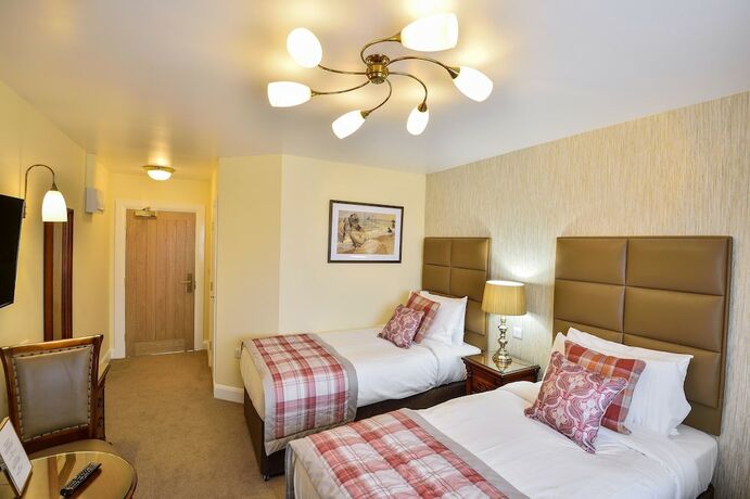 Imagen de la habitación del Hotel The Coach and Horses. Foto 19