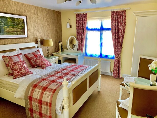 Imagen de la habitación del Hotel The Coach and Horses. Foto 20