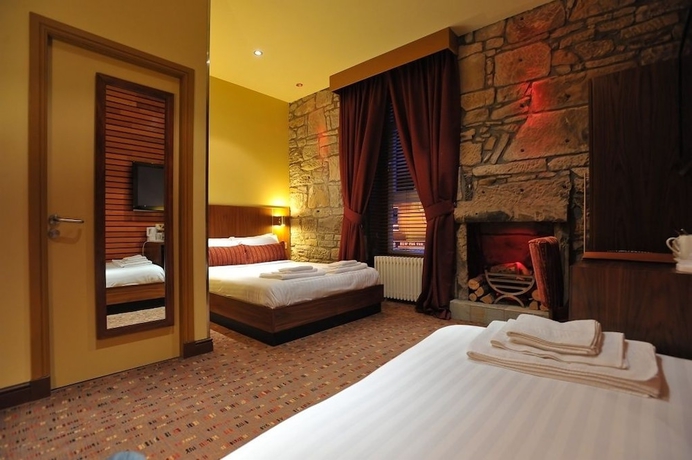 Imagen de la habitación del Hotel The Commercial. Foto 13