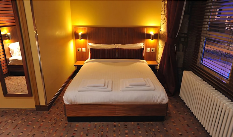 Imagen de la habitación del Hotel The Commercial. Foto 16