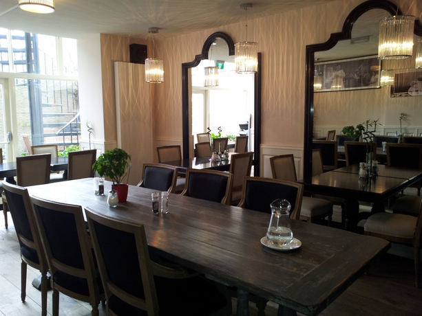 Imagen del bar/restaurante del Hotel The Concert. Foto 2