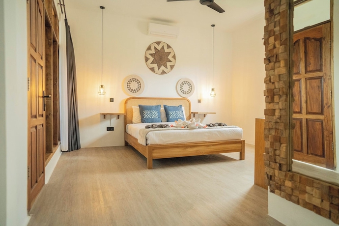 Imagen de la habitación del Hotel The Confidential Mandalika. Foto 2