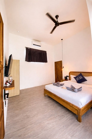 Imagen de la habitación del Hotel The Confidential Mandalika. Foto 5